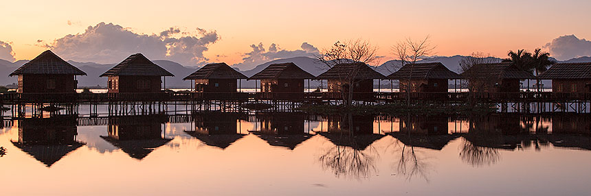 sunset behind cottages