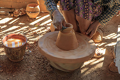 woman with potting wheel