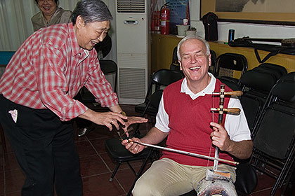 Erhu player with John