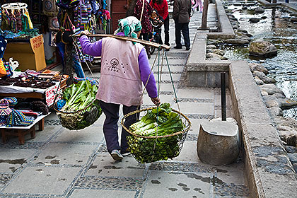 Woman carrying vegetables