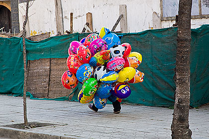 Man carying balloons