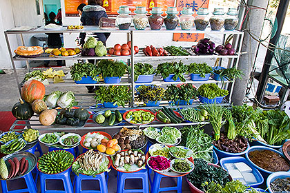 Restaurant entrance with vegetables displayed