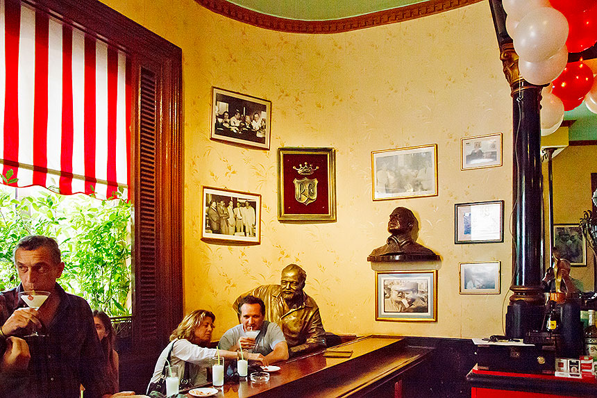 bar room with bust and statue of Hemingway