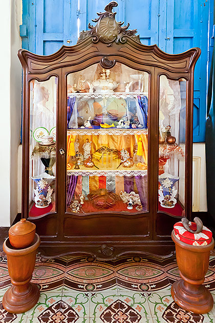 display case with pottery